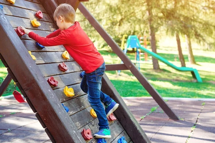 Cute Little Boy Playing On The Playground. Happy And Healthy Childhood. Kids Outdoors Playground.