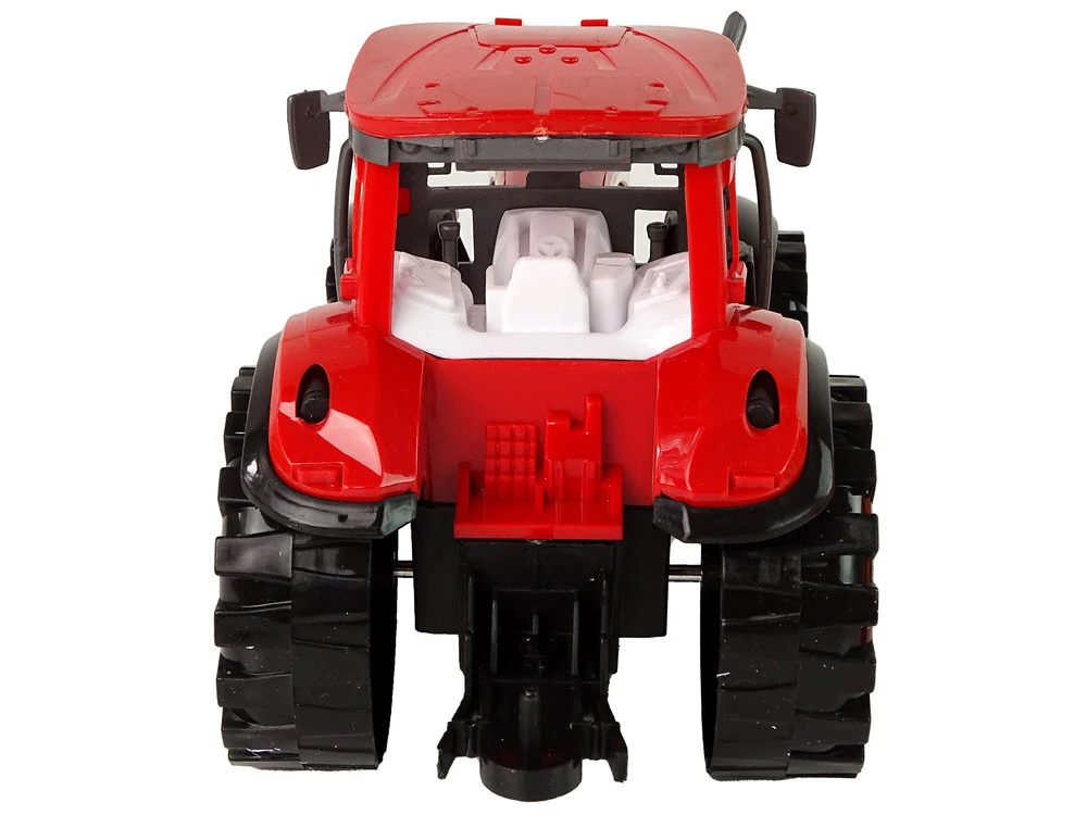Crveni traktor s narančastim pogonom kultivatora_5