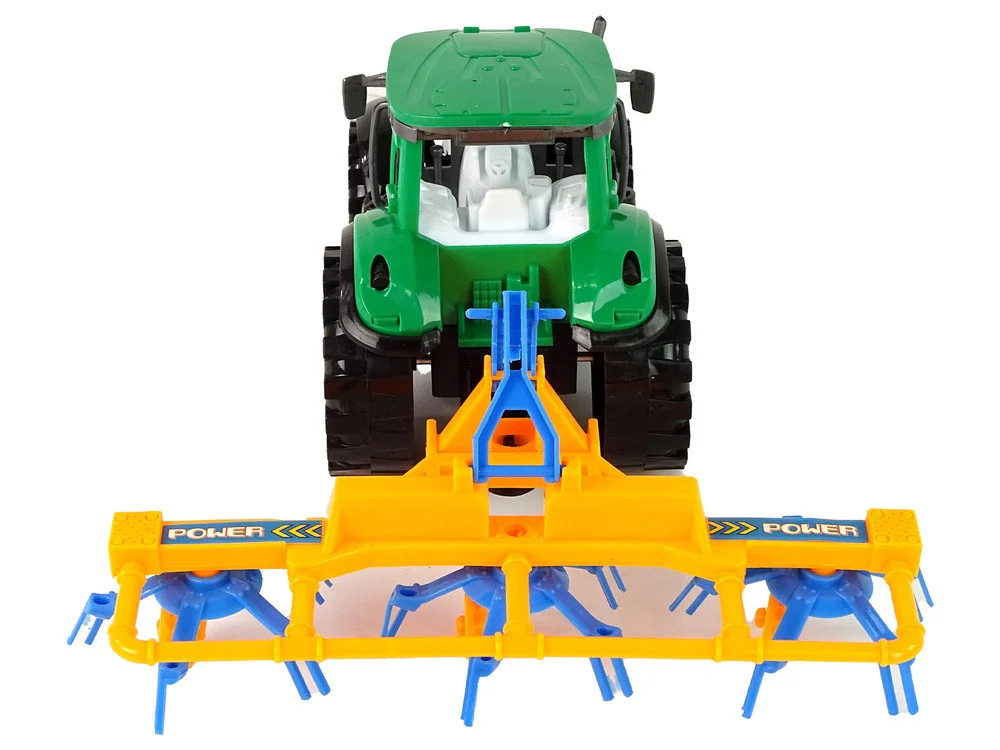 Zeleni traktor s narančastim i plavim pogonom trenja grablja_4